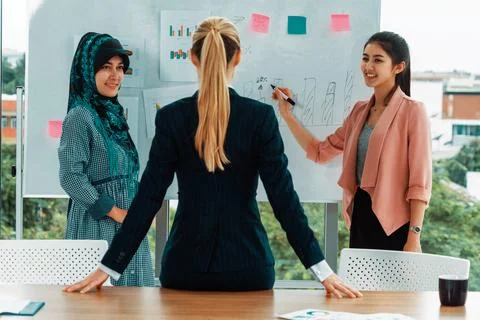 Multicultural working group in teamwork meeting. uds Stock Photos