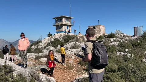 Multicultural young adults having fun in nature on top of the mountain Stock Footage 148144684