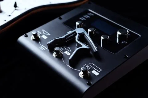 Multieffects Processor for Electric Guitar on black background. Stock Photos
