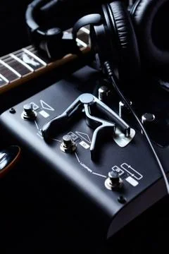 Multieffects Processor for Electric Guitar on black background. Stock Photos