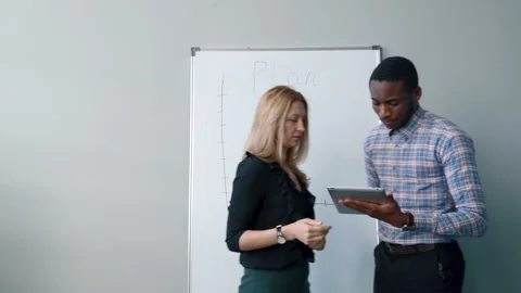 Multiethical business people make plan on magnetic board for performances. Stock Footage 86420595