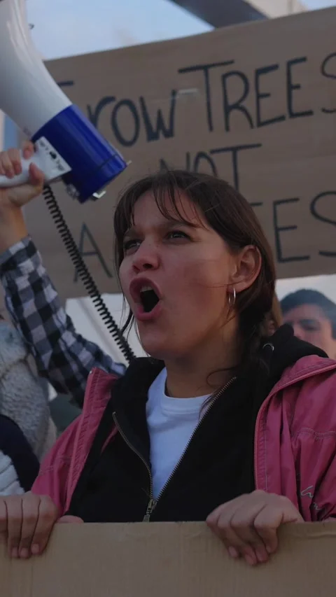 Multiethnic activists protesting against war with signs and megaphones Stock Footage 318362679