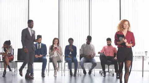 Multiethnic applicants sitting in queue for getting a job Stock Footage 166610937