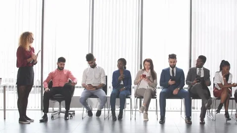 Multiethnic applicants sitting in queue for getting a job Stock Footage 166611347