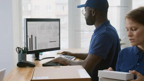 Multiethnic Associates Working with Parcels at Courier Delivery Company Office 스톡 동영상 321434805