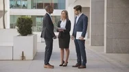 Multiethnic Business People Discussing Papers Outdoor Stock Footage