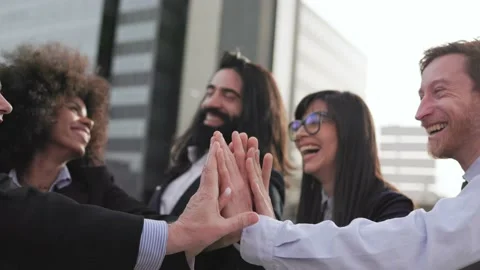 Multiethnic business people stacking hands with colleagues outdoor Stock Footage 212970993