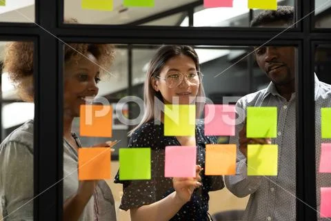 Multiethnic business team brainstorm write ideas on sticky notes Stock Photos
