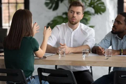 Multiethnic business team brainstorming at meeting table Stock Photos