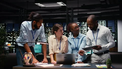 Multiethnic business team engaged in collaborative teamwork inside office Stock Footage 334039929