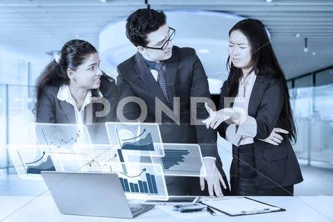 Multiethnic businesspeople and virtual graph Stock Photos
