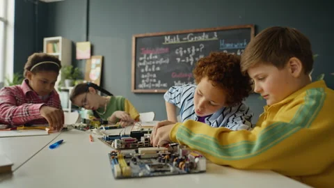 Multiethnic Children Assembling Robotics Project in Stem Class Stock Footage 340550742