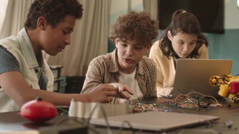 Multiethnic Classmates Constructing Robots Video stock 204894388