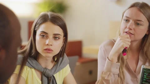 Multiethnic colleagues discussing code in office Stock Footage 142543580