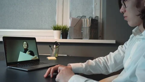 Multiethnic Colleagues Having Video Conference Late at night Stock Footage 148344997