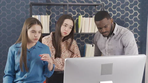 Multiethnic colleagues share ideas on strategy together at office meeting. Stock Footage 228805589