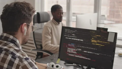 Multiethnic Computer Programmers Coding in Office Stock Footage 236101181