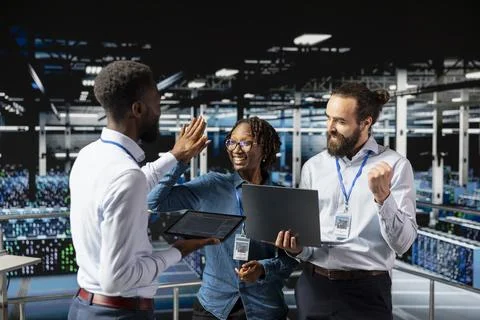 Multiethnic confident team sharing a high five to celebrate achievement Stock Photos