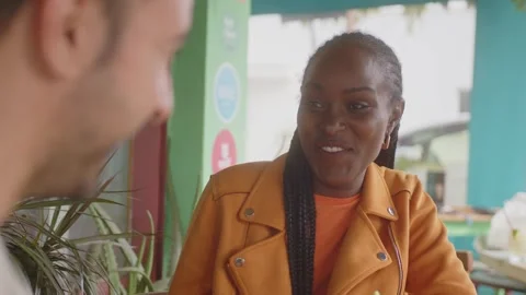 Multiethnic couple having fun drinking cocktails at bar on date Video stock 244546317