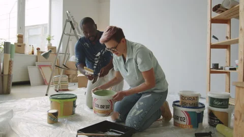 Multiethnic Couple Preparing Paint for Home Renovation Stock Footage 148211949
