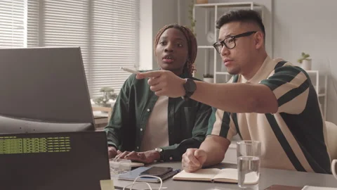 Multiethnic Couple of Programmers Working in Team Video stock 195980982