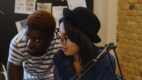 Multiethnic Creative Designers Having Discussion in Studio Stock Footage 115460940