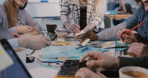 Multiethnic creative team working on brainstorming behind the table, camera Stock Footage 106155442