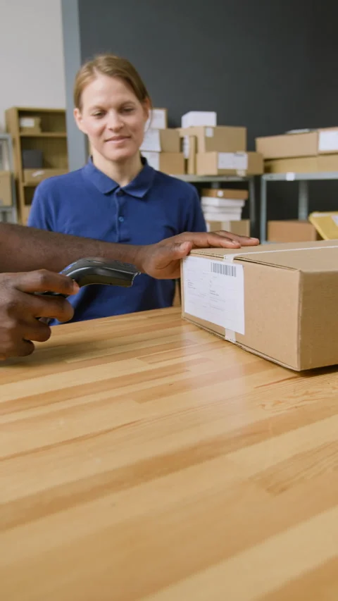 Multiethnic Delivery Outlet Workers Giving Parcel to Female Customer Stock Footage 321463620