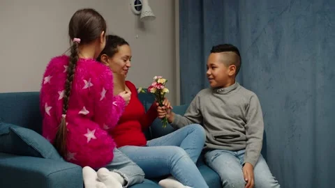 Multiethnic diverse children congratulating mom on holiday at home Stock Footage 170380768