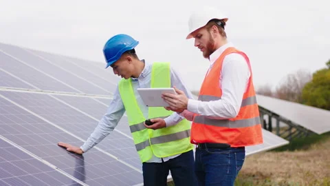 Multiethnic ecological engineers at the energy power station controlling the Stock Footage 164549194