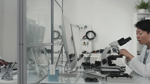 Multiethnic Electronics Engineers Working in Lab Stock Footage 170116790