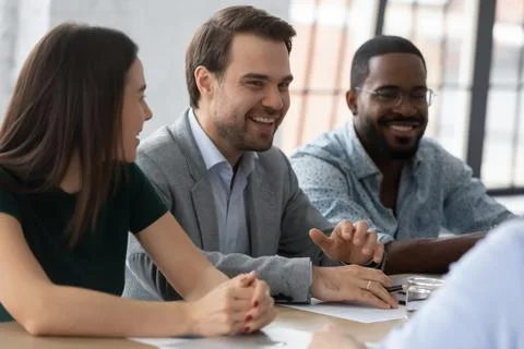 Multiethnic employer HR managers team smiling and laughing Stock Photos