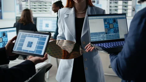 Multiethnic engineering team examines silicon wafer, trialing advanced materials Stock Footage 335880784