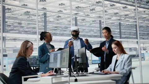 Multiethnic engineering team in semiconductors factory office using VR headset Stock Footage 335882048