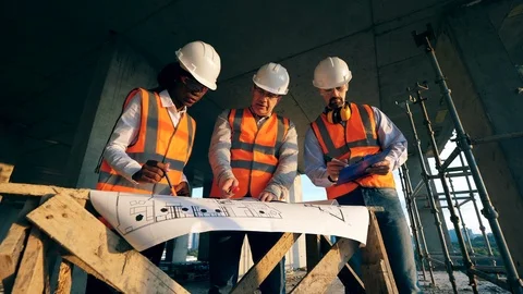 Multiethnic engineers, architects discussing construction plan. Engineers work Video stock 124306334