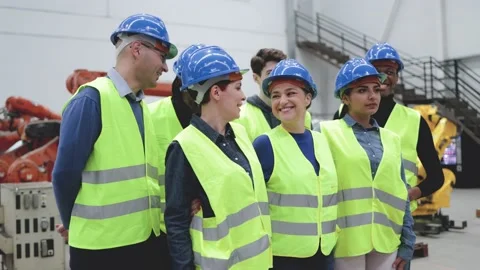 Multiethnic engineers working at automation and robotics facility - Industry Stock Footage 212682960