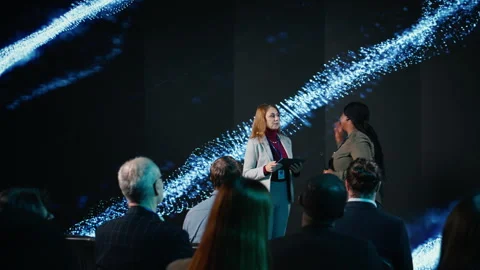 Multiethnic female adults hosting a panel discussion with market share trends Stock Footage 327823909