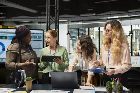 Multiethnic focused partners uniting to create a new vision and exchange data Stock Photos