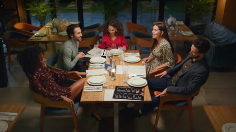 Multiethnic friends group celebrating having fun in evening fancy restaurant. Stock Footage 171133152