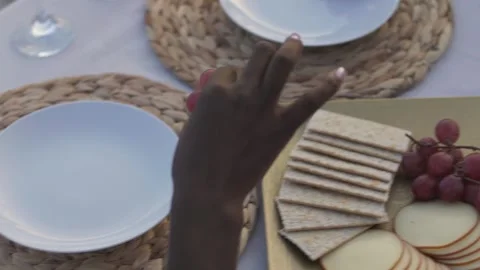 Multiethnic friends having light meal with cheese and fruit Stock Footage 270249948