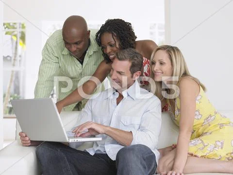 Multiethnic Friends With Laptop Stock Photos