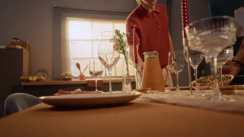 Multiethnic Friends Setting Table for Friendsgiving Dinner at Home Stock Footage 345229744