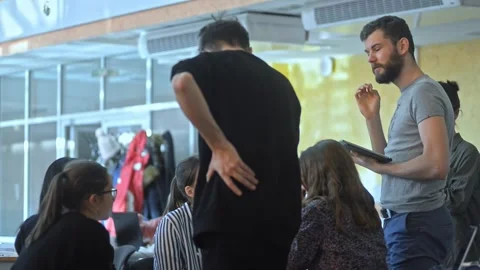 Multiethnic friends students are working on project and using gadgets at table Stock Footage 135812643