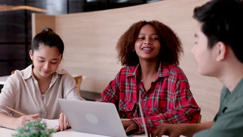 Multiethnic friends studying together in the library preparing for exams, A.. 스톡 동영상 246720613