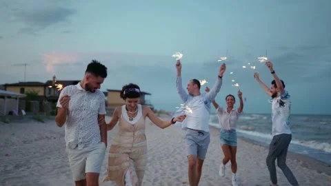 Multiethnic friends walking, dancing, having fun on night party at seaside with Stock Footage 198563007