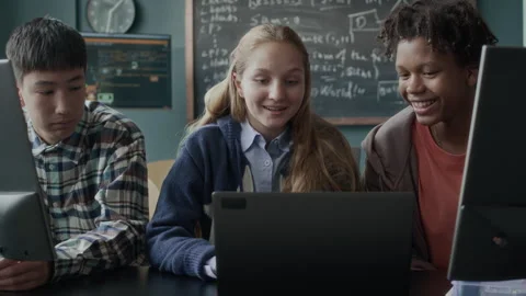 Multiethnic Gen Z Students Chatting during Programming Lesson Stock Footage 284435691