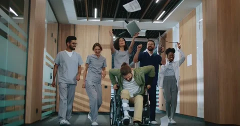 Multiethnic group of cheerful professional doctors and nurses dancing with happy Stock Footage 256158728