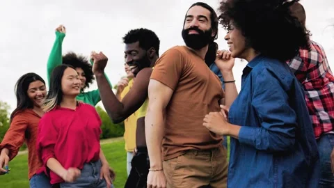 Multiethnic group of diverse friends having fun dancing together outdoor Stock Footage 196472693