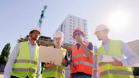 Multiethnic group of engineers and architect analyzing the plan of work with the 스톡 동영상 141190129