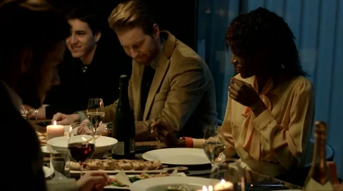 Multiethnic group of friends having dinner together. Stock Footage 61158023